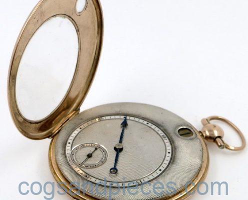 Gold, jump hour cylinder pocket watch