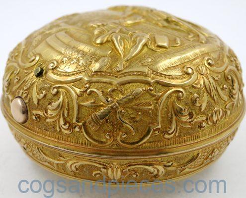 Gold repousse pair cases
