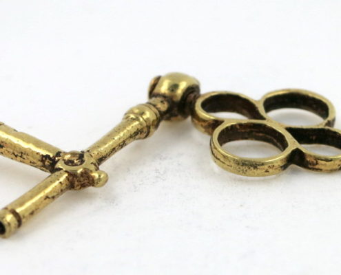 Gold crank watch key