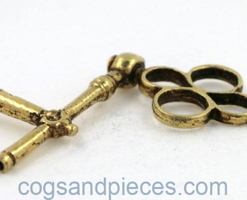 Gold crank watch key