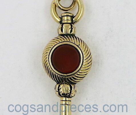 Gold watch key