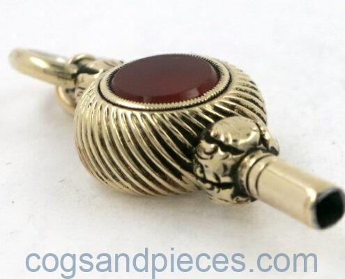 Gold watch key