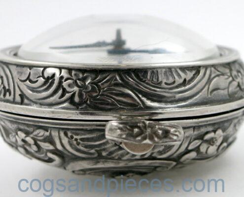 Silver repousse pair cases