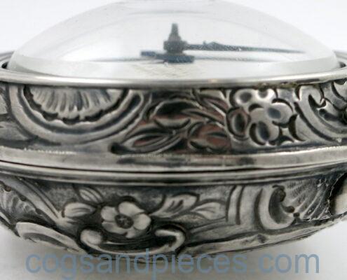 Silver repousse pair cases