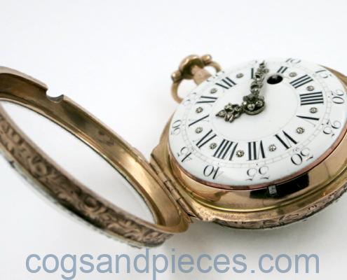 gold skeletonised pocket watch