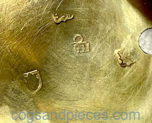 Gold repousse watch