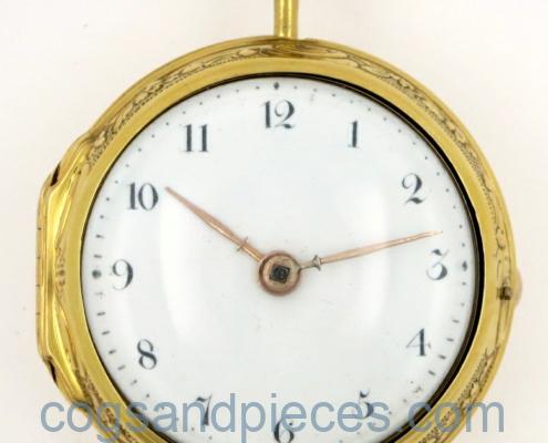 Gold repousse watch